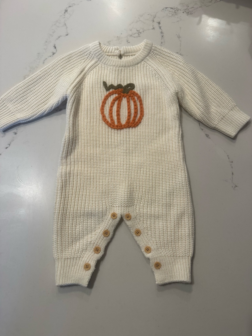 Cream Knit Baby One-Piece with Orange Pumpkin. 12 months